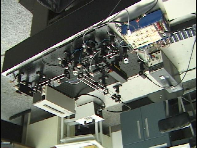 White Light InGaAs Photodetector Beamsplitter HeNe Laser Sample Photograph 1: Fourier-transform spectrometer setup III.
