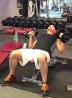 DB Incline Chest Press Lie on a bench with the backrest inclined