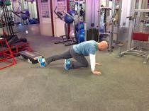 Mountain Climber Brace your abs. Start in the top of the pushup position.