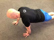 Offset Pushup Keep your abs braced and body in a straight line from toes to shoulders.