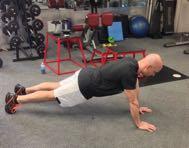 Move into the pushup position by pushing through the floor through your hands, raising one arm
