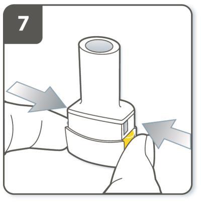 You should hear a click as it fully closes. Pierce the capsule: Hold the inhaler upright with the mouthpiece pointing up. Press both buttons together firmly at the same time.