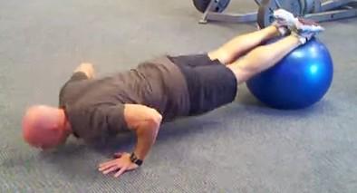 Tuck your knees to your chest by rolling the ball to your chest by contracting