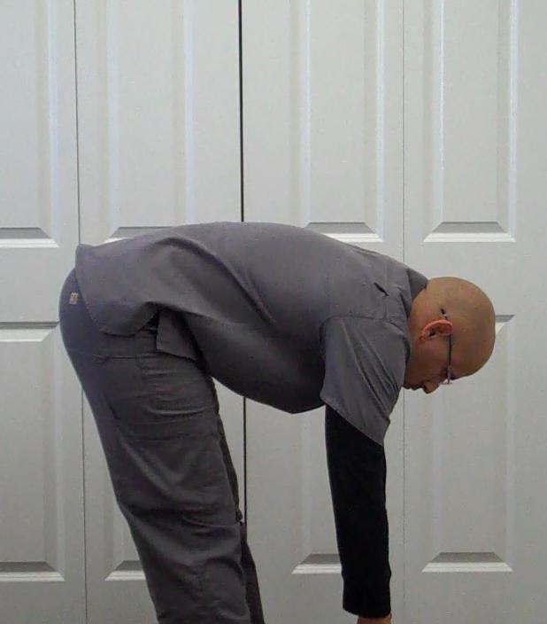 Flexion Test Stand up with your feet shoulder width apart.