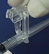 Nest rotate the syringe barrel so the graduations along its side are face up and