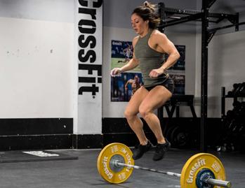The rep ends when the athlete lands on both feet on the opposite side of the barbell.