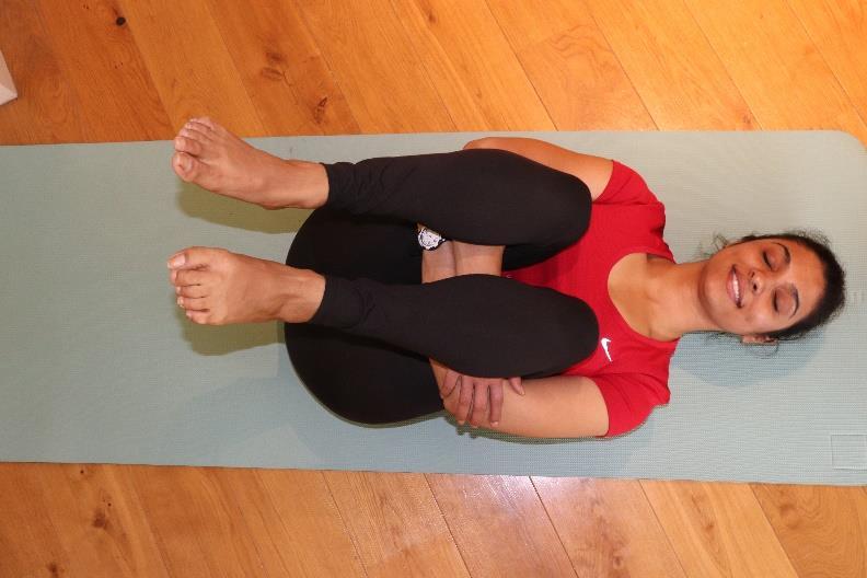Grab your hands around your legs and hug the sine bone (lower leg) or inner thighs, Press your thighs towards your abdomen.