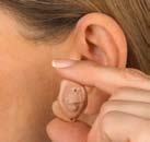 Pull your earlobe down slightly and press on the instrument to ensure it is firmly in place.