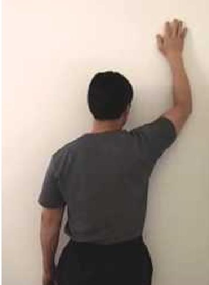 WALL SHOULDER HAND CRAWL STRETCH 1. Place your hand of the injured arm/shoulder on a wall up around ear level then step right up to the wall and place your chest against it. (Starting position) 2.