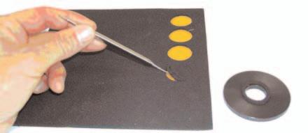 7 Spread the provided adhesive over calibration plate outside the