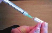 4) Inject the water through the rubber bung into the hydrocortisone vial. Mix well by gently shaking.