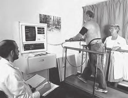 *(b) The treadmill test can be used to diagnose heart problems. This test requires a person to walk on a treadmill whilst an electrocardiogram (ECG) is recorded.