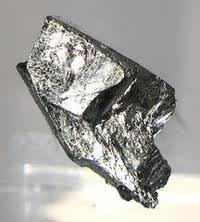 Diamond (D) Thius coccurs naturally in borates and in the silicates:- tourmaline, axinite and datolite.this is a very hard material with a dark, non-metallic lustre.
