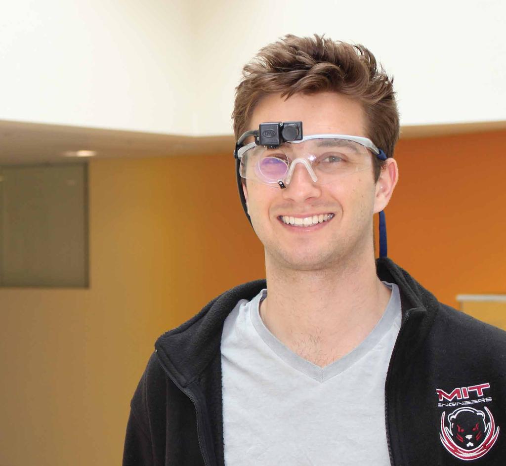 2 3 BCS undergraduate Ian Zaun demonstrates ASL Eyetracking glasses.