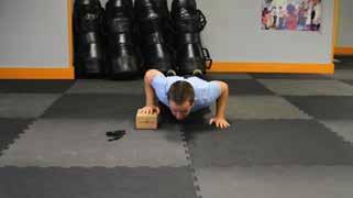 Elevated Pushups Keep the abs braced and body in a straight line from knees to shoulders.