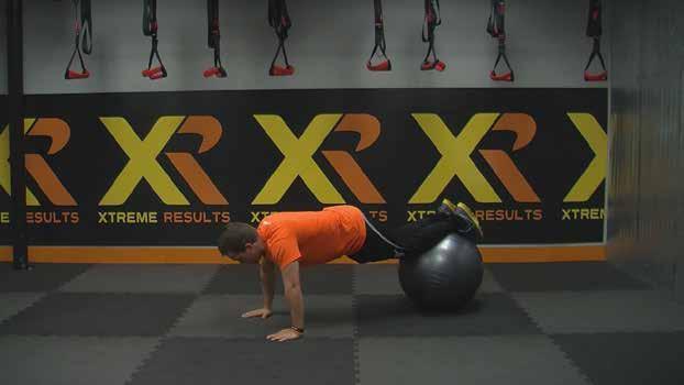 Keeping your back straight (don t round it), roll the ball as close to your chest as possible by contracting your abs and pulling it forward.