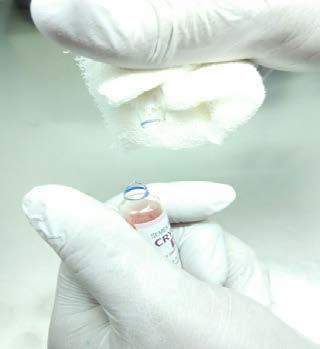 area (blue ring) Figure 5b: Wrap the tip of the vial in