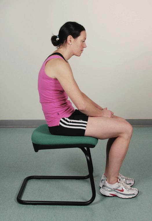 Lower back pain caused by stiffness or weakness and by sitting or standing with the spine in poor alignment.