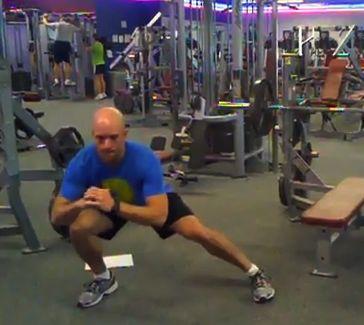 Take a large step sideways (laterally) with one leg into a wide squat