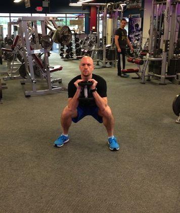 Workout A Goblet Jump Squat and Stick Squat down with your feet just outside shoulder
