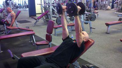 Push the dumbbells straight up using your chest, shoulders and triceps.