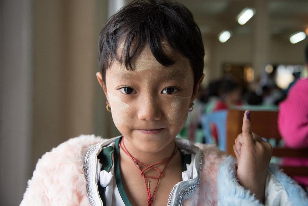 JE VACCINE PATH/Thet Htoo A young girl in Shan State, Myanmar, proudly displays her freshly