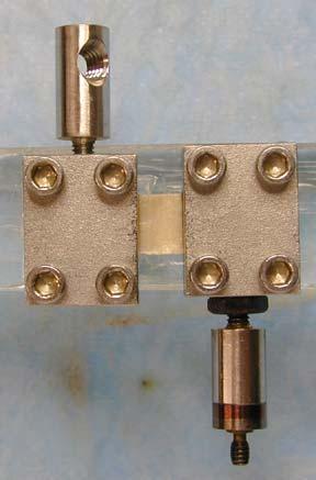 clamps. Fiber direction is aligned along horizontal axis.