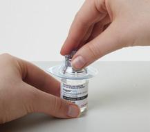 d) Remove the protective cap from the vial, and wipe the rubber stopper with an alcohol wipe.