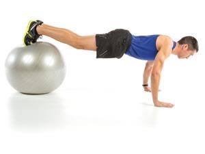 KNEE TUCKS Muscle Targets: Hip flexors, abs (transverse) Equipment: Stability ball 1.