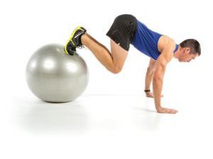 More: The Best Core Exercises for Runners 2. Keeping your upper body steady, bend your knees and roll the ball inward toward you. Tip: Getting your feet on the ball may take a little finesse.
