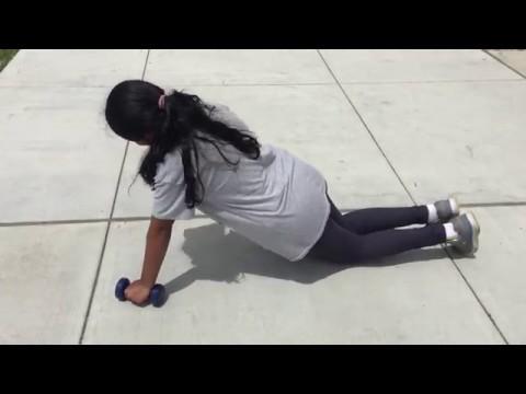 Dumbbell push up (knees down) Description: In this exercise, you will need to get into a plank position and your hands should be slightly wider than shoulder width apart.