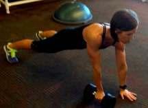 chest level. 5. Simultaneous with bringing the dumbbell forward, bring right knee in as a means to contract abs. 6.