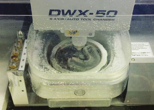 Figure 22. Transfer to CAM software for processing. Figure 23. Milling splint using Roland DWX 50.