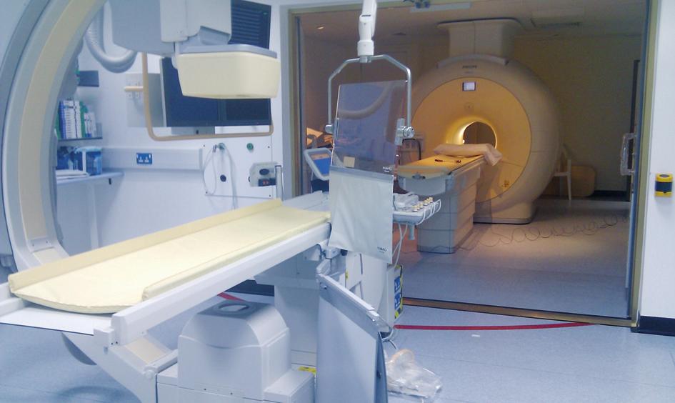 Fig. 1 Hybrid X-ray and cardiac magnetic resonance imaging suite. The CMR examination was performed with a 32-channel cardiac phased-array receiver coil.