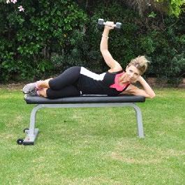 DB Lying Lateral Raise Preparation: Lie down on your side on an elevated bench, leaning on your elbow for support. Grasp a light dumbbell with the other hand.