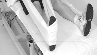 Slide the operated leg sideways in bed, keeping