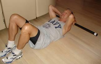 Abdominal Crunch with Neck and Head Supported Lie on the back with legs bent and feet flat on the floor. Place the Body Bar FLEX behind the neck with hands lightly grasping bar, palms facing down.