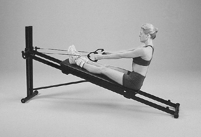 Intermediate Exercises for Men & Women continued #7 Stretcher Unhook arm pulley cable. Grasp pulley handles. Sit facing the height adjustment column with legs on glideboard.