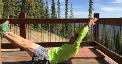 Begin lowering your legs as low as you can without transferring the stress to your lower back and PRESS BACK INTO MAT as you also bring your shoulder off the ground (keeping your biceps close to your