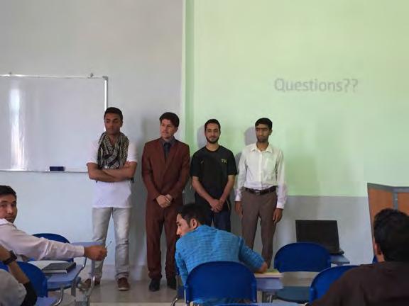Figure 6: HUFA students answering questions from faculty and students following their research seminar.