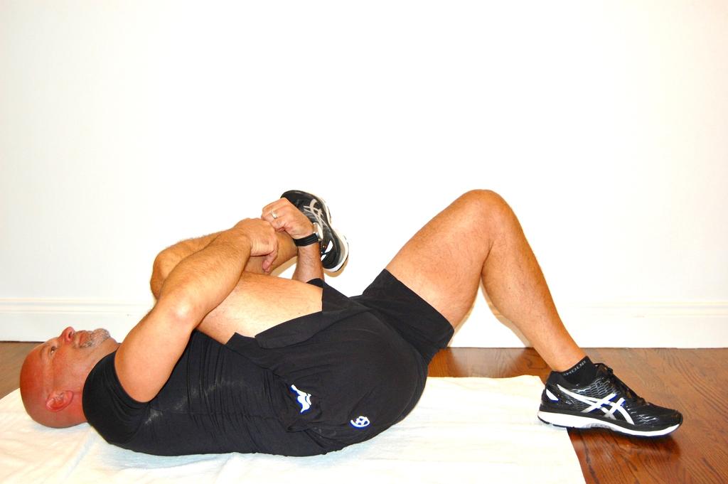 Gluteal (Rear) Stretch This exercise stretches your rear (Gluteals) and makes walking easier Lie on a mat