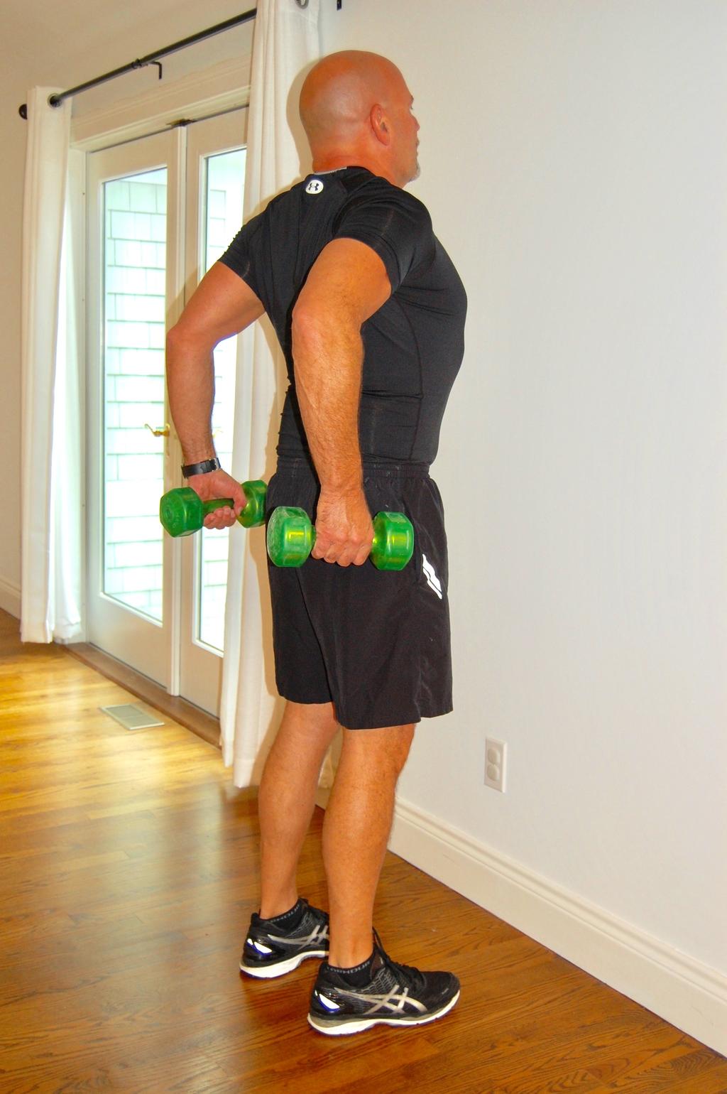 Standing Elbow Extension This exercise strengthens the muscles in the back of your shoulders. Stronger shoulders means stronger arms.