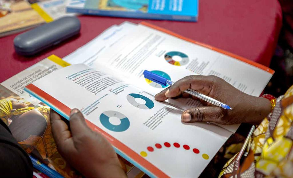 Woman reading findings from the Joint Programme's research HUMAN RIGHTS TO WATER AND SANITATION AT THE HEART OF THE JOINT PROGRAMME S MISSION The human right to water and sanitation was adopted by