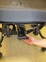 sideways (or remove foot supports) 3. Have user part knees slightly. Grasp sliding leg mechanism at front as shown below.