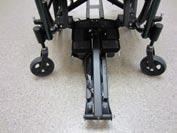 Pull leg mechanism out fully until it rests on the ground in-front of the chair. 5.