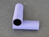 PVC Pipe. Cost-Minimal. Used for rolling and self massage. Can be covered with yoga matting and secured with glue. Cut to desired length.