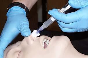 4 Gently twist naloxone vial into syringe until you feel it catch.
