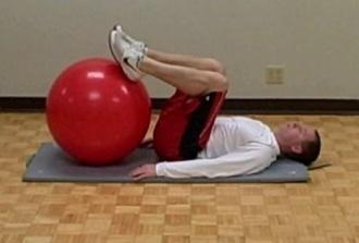 Bridge- Feet on ball Coaching Tips: Find a medium sized stability ball, place your feet on very top and middle of the