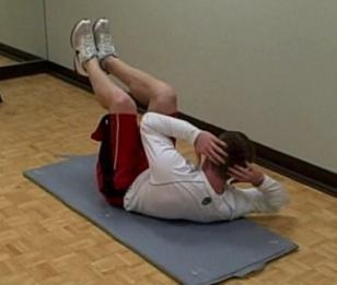 Draw your abs in and squeeze your glutes, then slowly raise your shoulder off the floor towards the opposite knee.