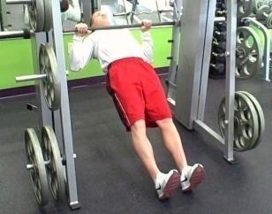 Body Row Coaching Tips: Adjust the bar to mid-thigh height. Grab the smith bar (be sure the bar is locked in place).